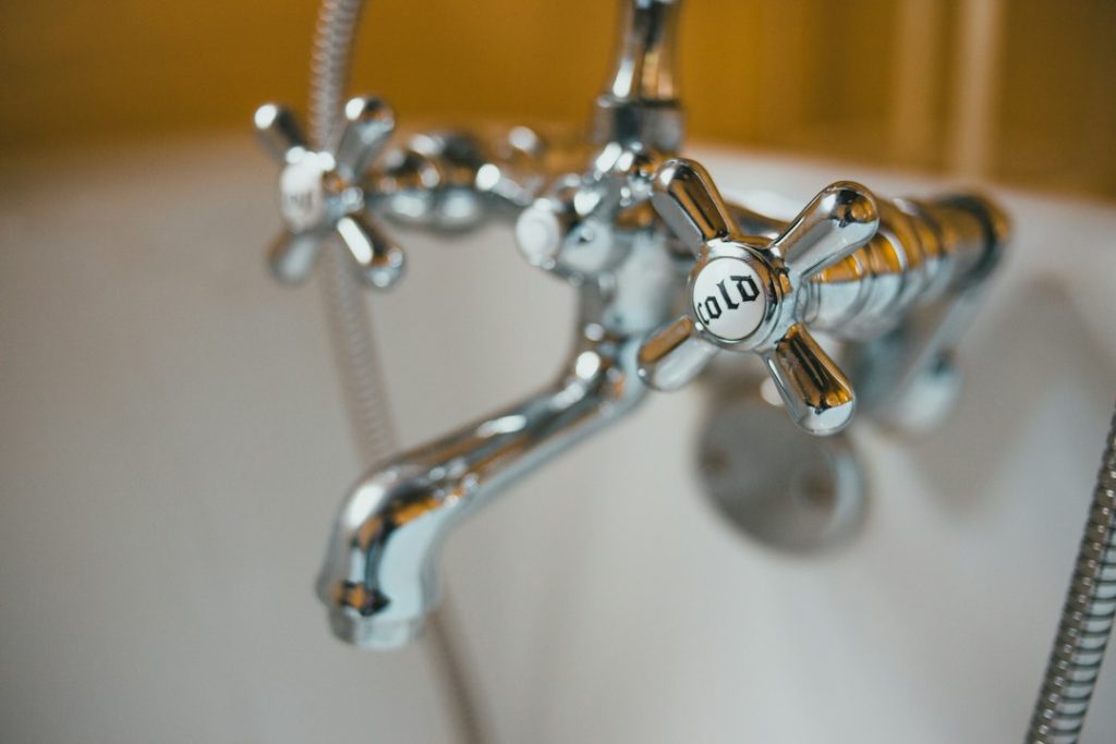 Water dripping from a bathroom faucet